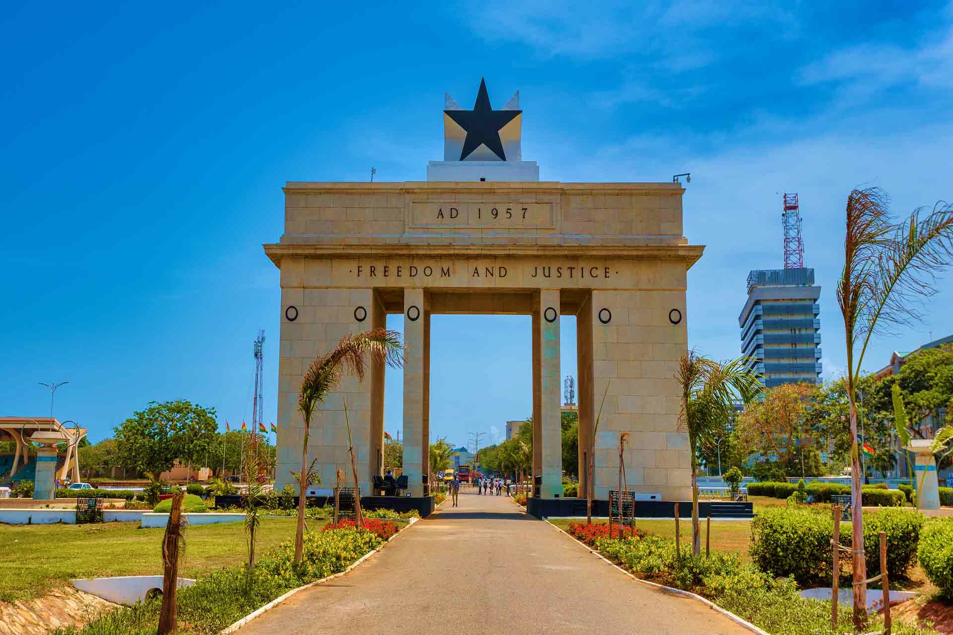 Independence Arch monument in Accra, Ghana with "Freedom and Justice" inscription and black star, major historical landmark b